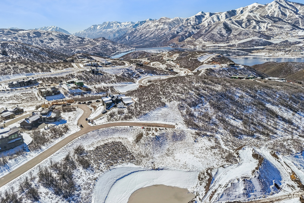 Snowy aerial view featuring a mountain view