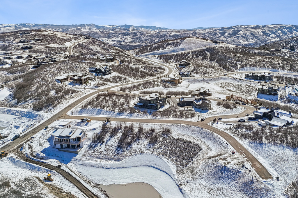 Snowy aerial view with a mountain view