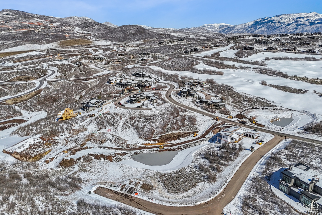 Snowy aerial view featuring a mountain view
