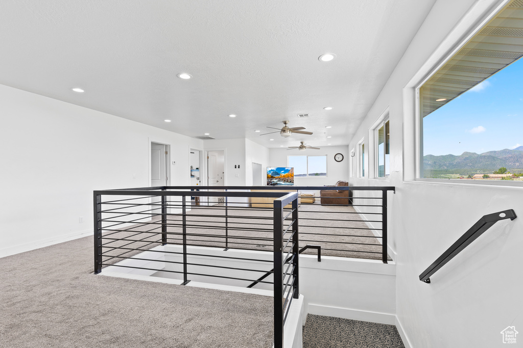 Staircase with recessed lighting, carpet floors, baseboards, and a ceiling fan