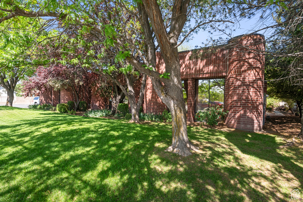 View of front of property with a front lawn and brick siding