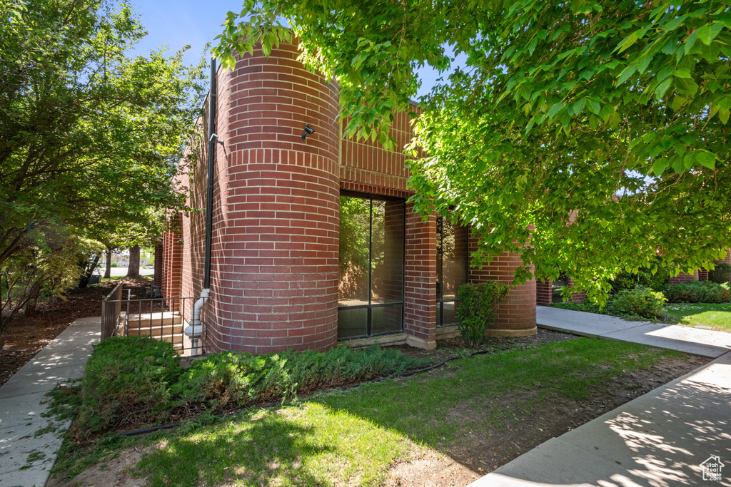 View of side of home featuring brick siding