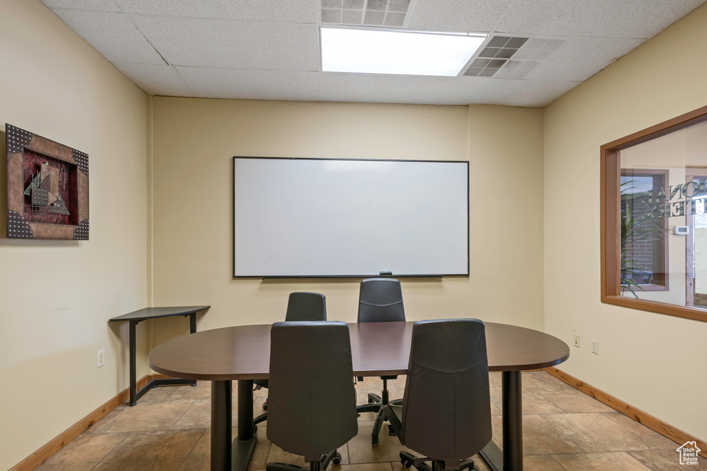 Home theater with baseboards and a paneled ceiling