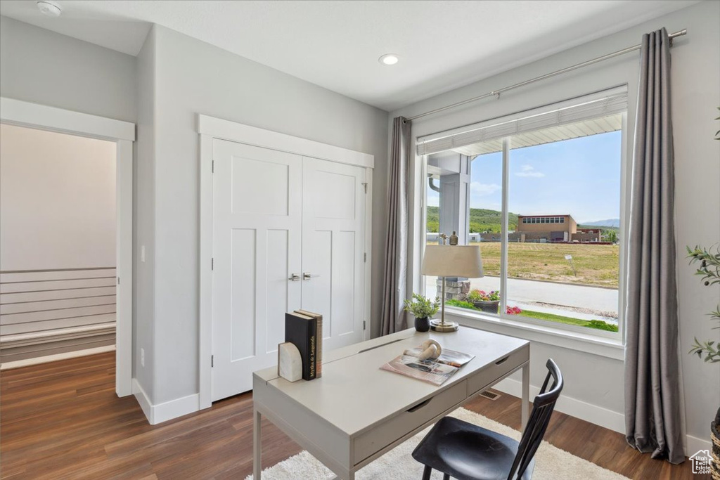 Office featuring baseboards, dark wood finished floors, and recessed lighting