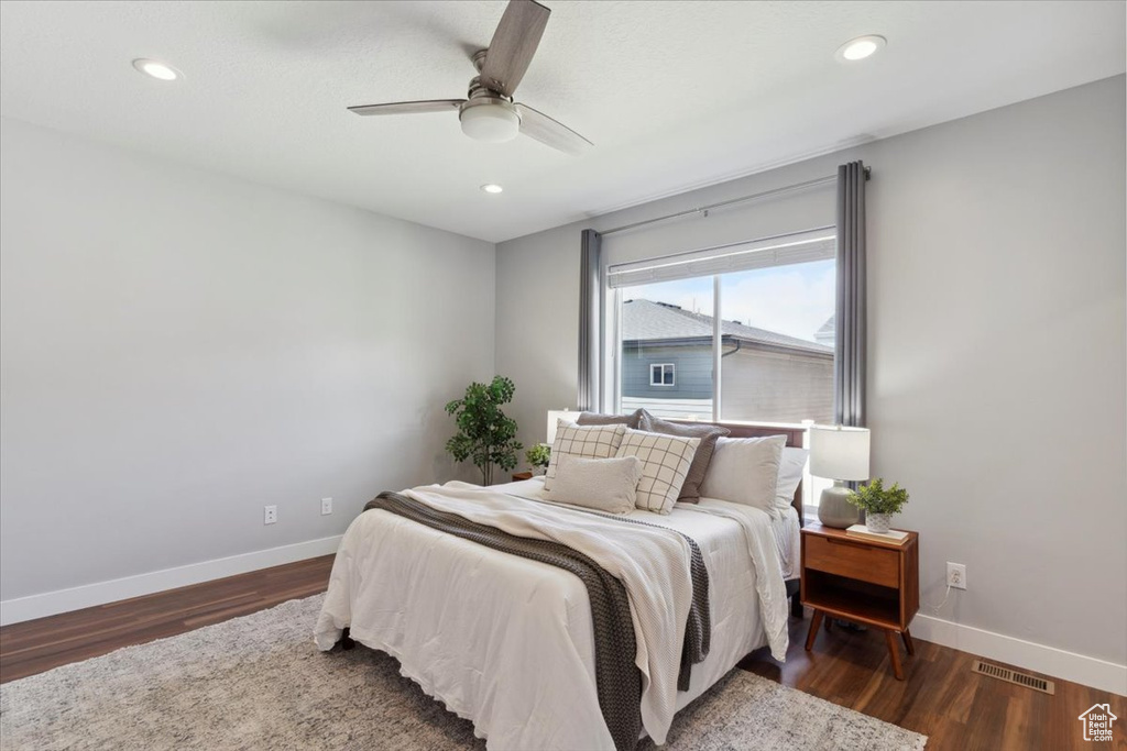 Bedroom with baseboards, wood finished floors, recessed lighting, and a ceiling fan