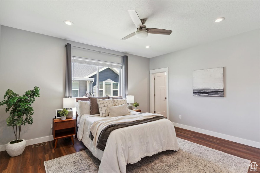 Bedroom with baseboards, wood finished floors, recessed lighting, and ceiling fan