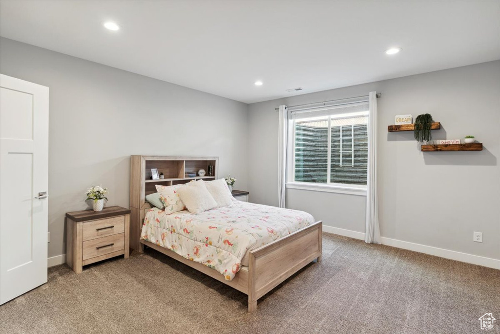 Bedroom with carpet floors, baseboards, and recessed lighting