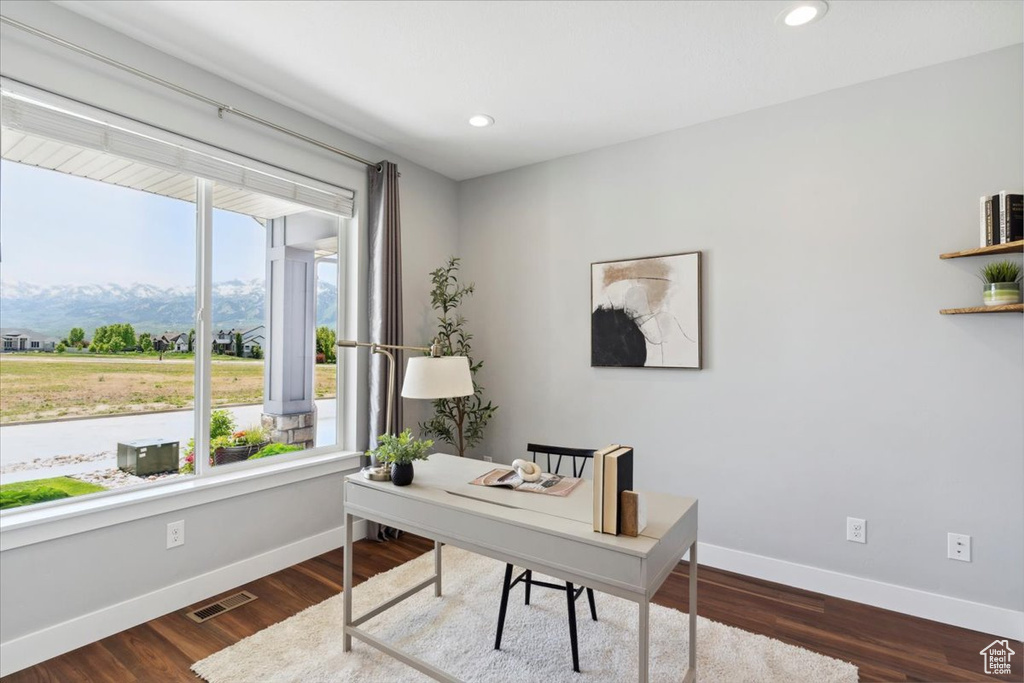 Home office featuring baseboards, recessed lighting, and dark wood-type flooring