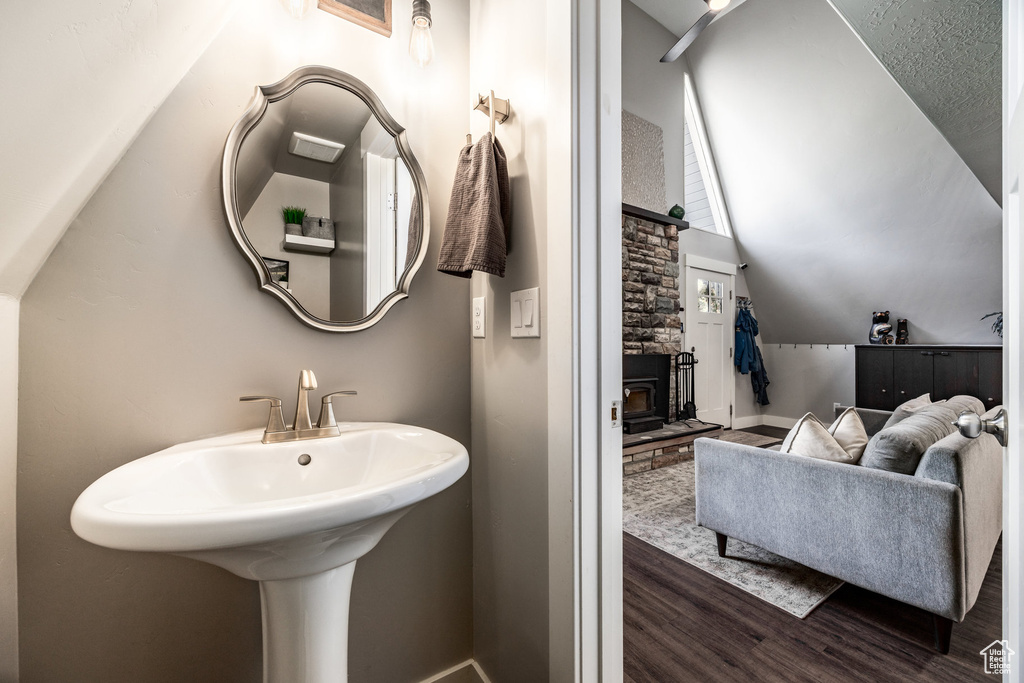 Bathroom featuring wood finished floors and baseboards