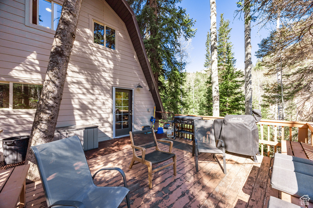 Wooden terrace with outdoor dining space