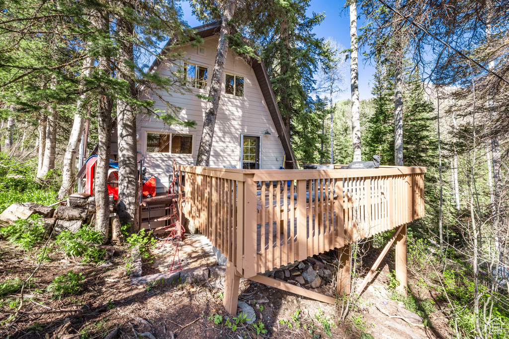 Rear view of house with a deck