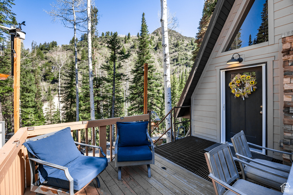 Wooden deck with a wooded view