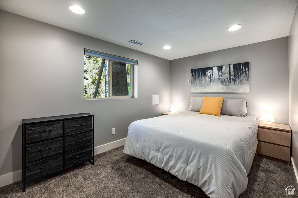 Carpeted bedroom featuring baseboards and recessed lighting