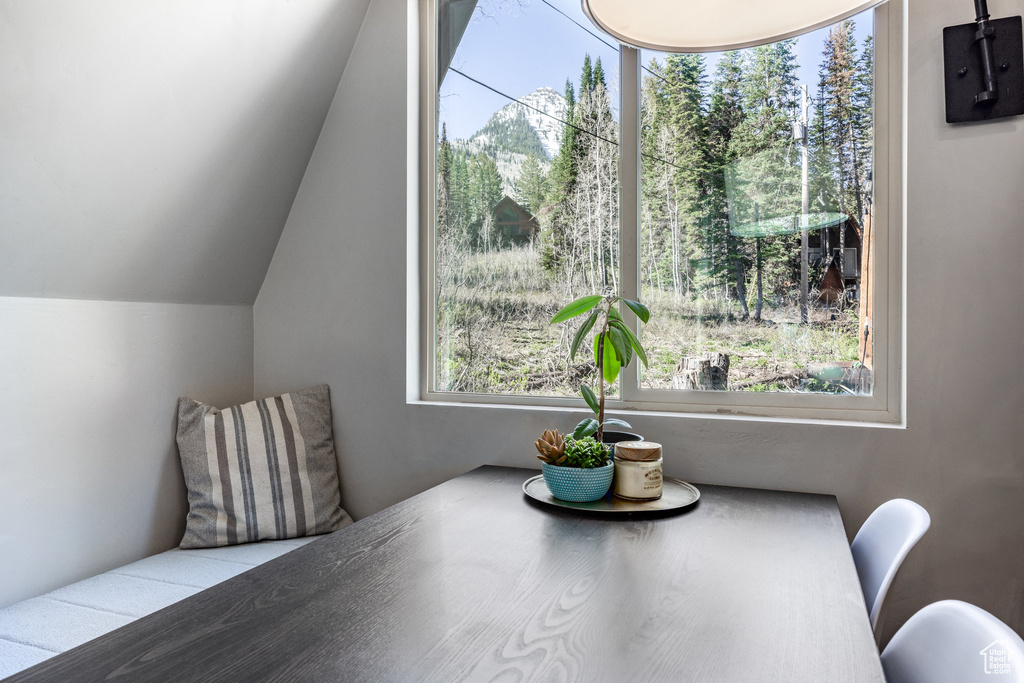 Dining space featuring lofted ceiling