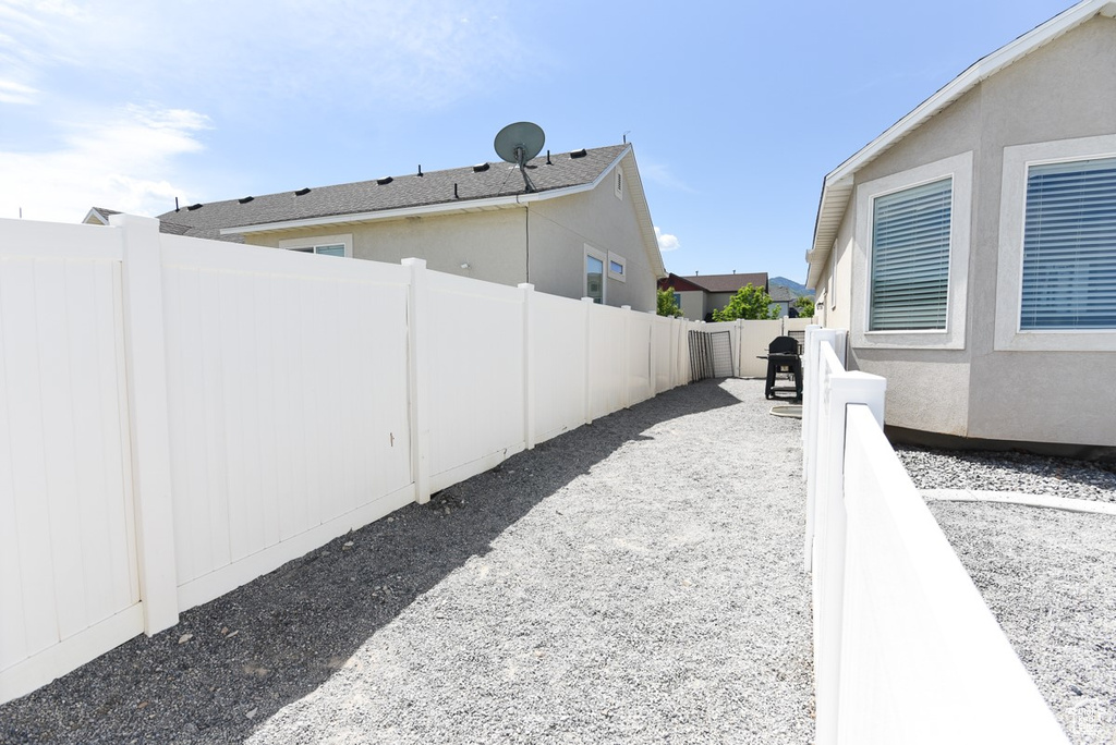 View of side of property featuring stucco siding