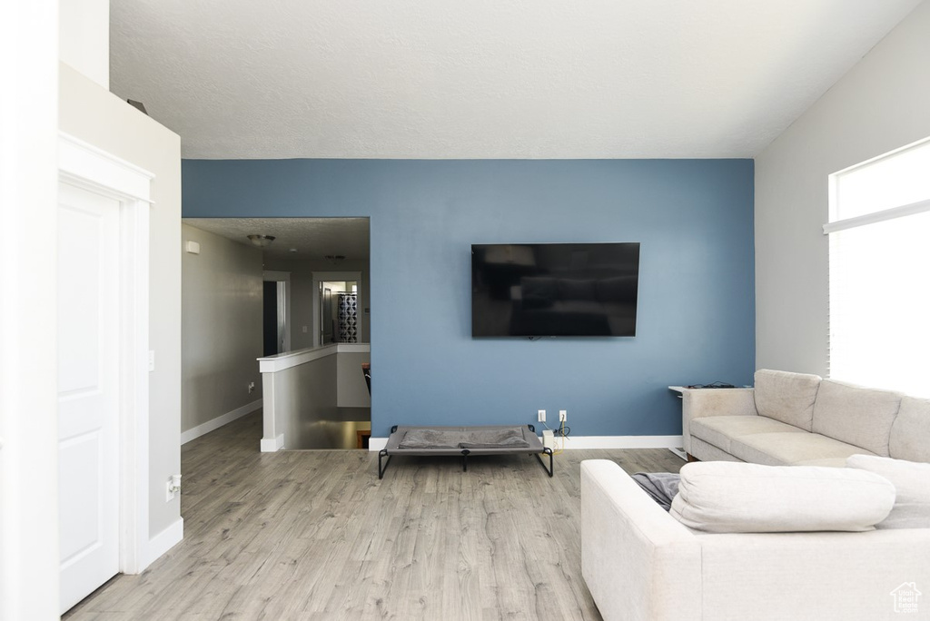 Living room with wood finished floors and baseboards