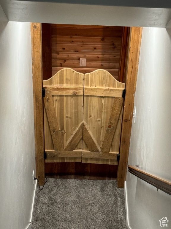 Detailed view of carpet floors and baseboards