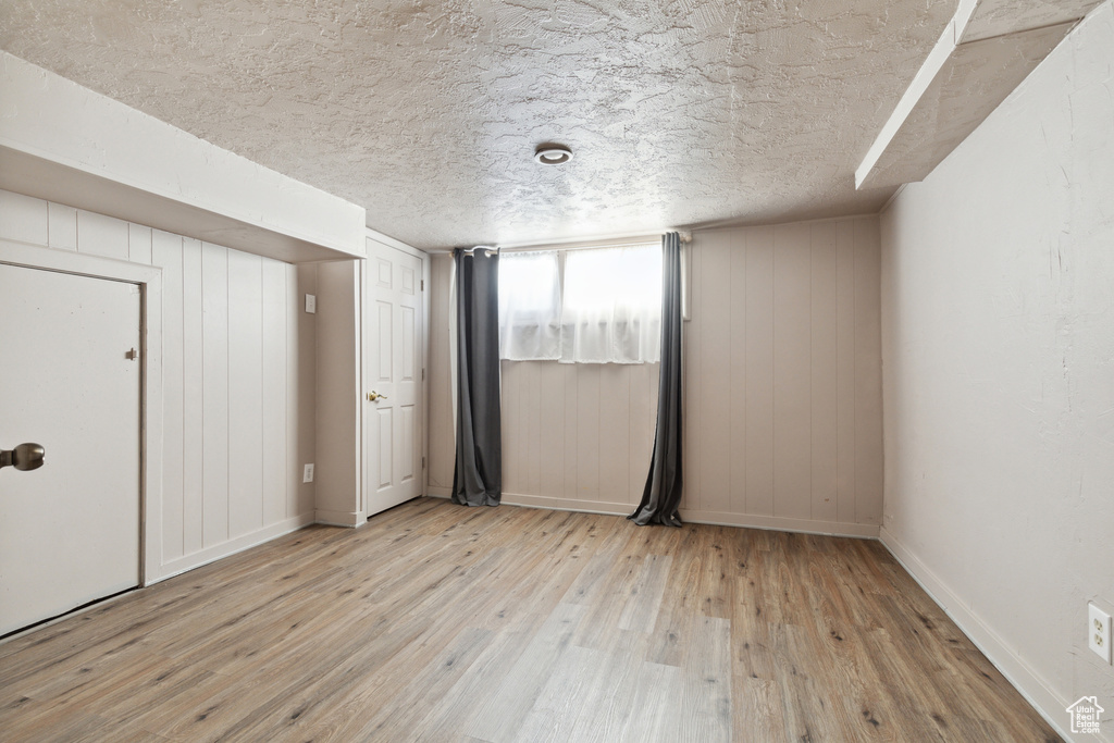 Unfurnished bedroom featuring wood-type flooring and baseboards