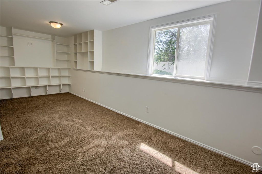 Unfurnished room with carpet floors and baseboards