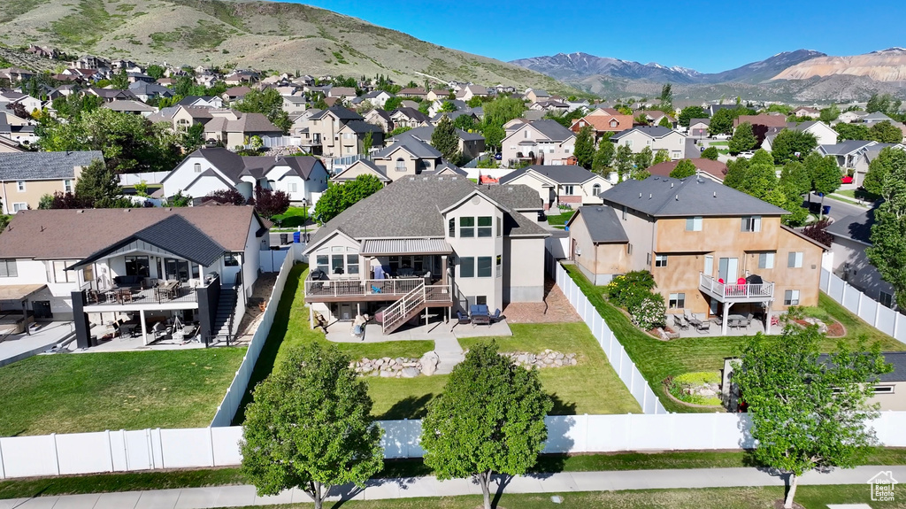 Aerial view of residential area featuring a mountain backdrop
