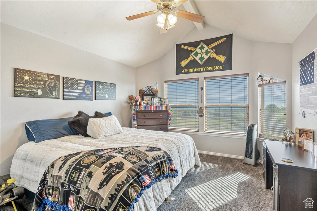 Carpeted bedroom featuring baseboards and ceiling fan