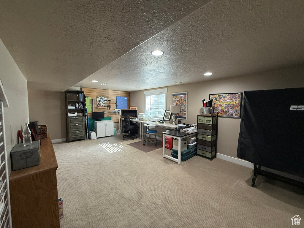 Office area featuring carpet, baseboards, a textured ceiling, and recessed lighting