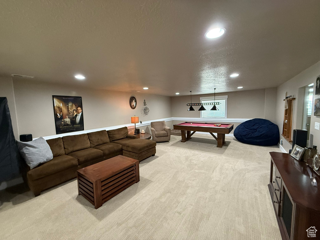 Living area featuring billiards table, light carpet, recessed lighting, and a textured ceiling