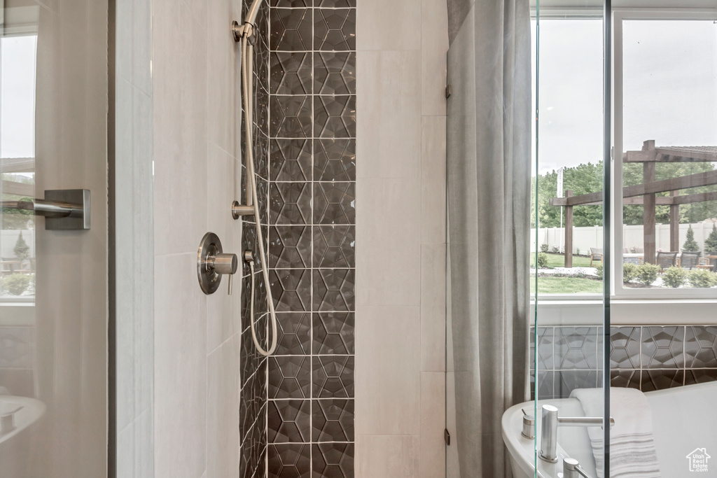 Full bathroom featuring a shower stall