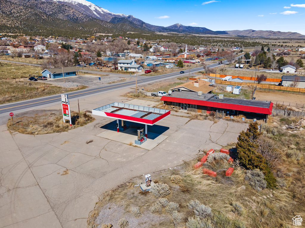 Aerial perspective of suburban area with a mountainous background