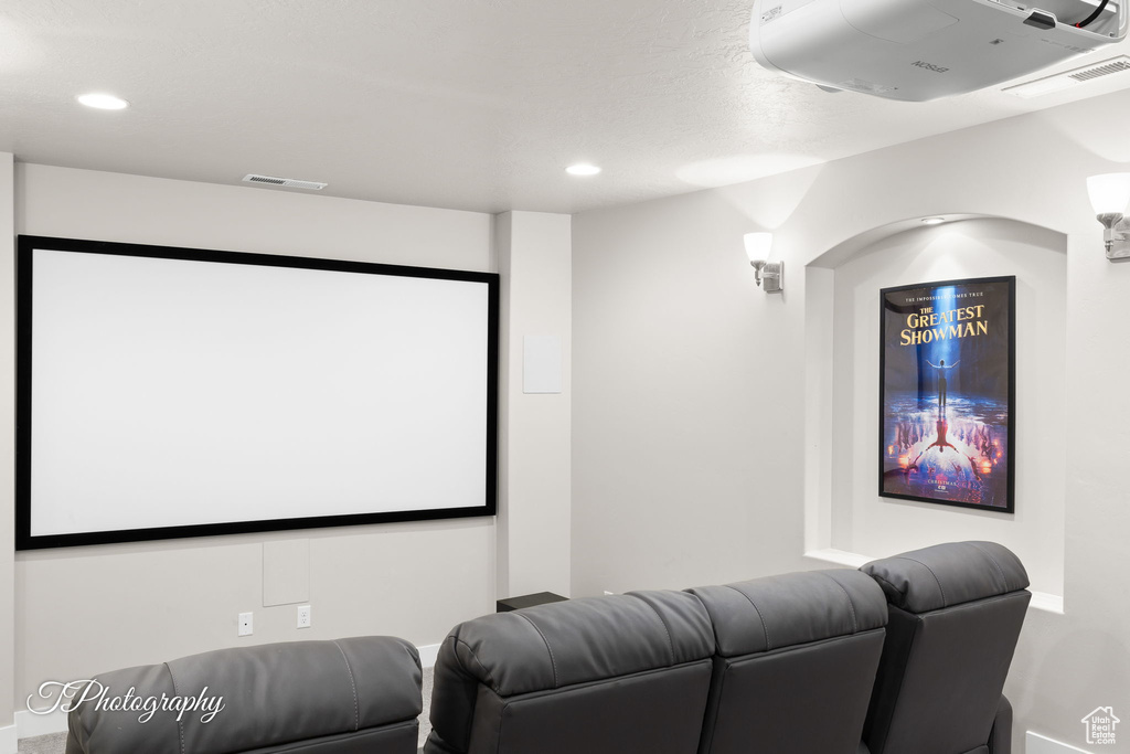 Home theater room with recessed lighting