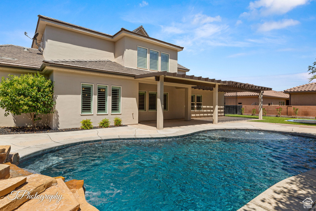 View of swimming pool with a patio