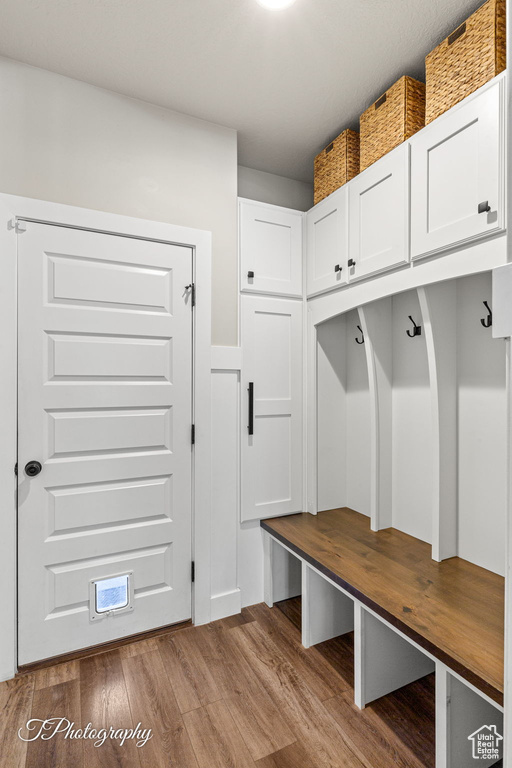 Mudroom with wood finished floors