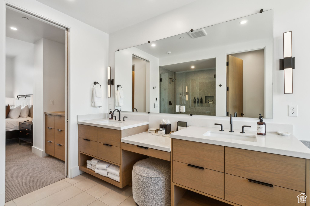 Full bath featuring vanity, a stall shower, connected bathroom, tile patterned floors, and recessed lighting