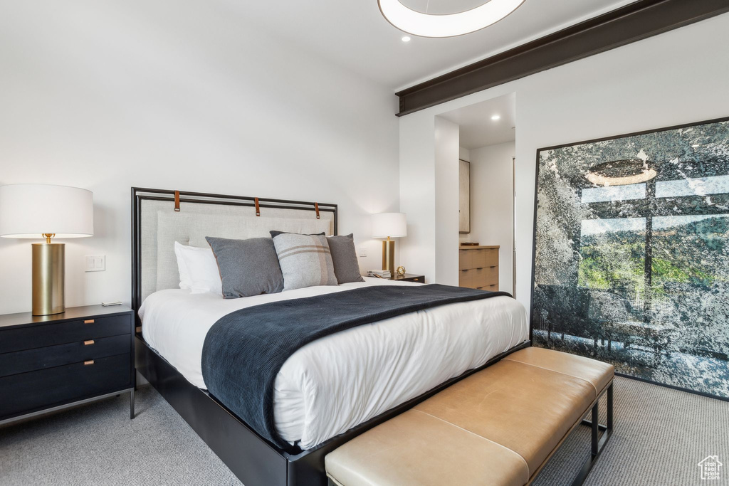 Carpeted bedroom with recessed lighting