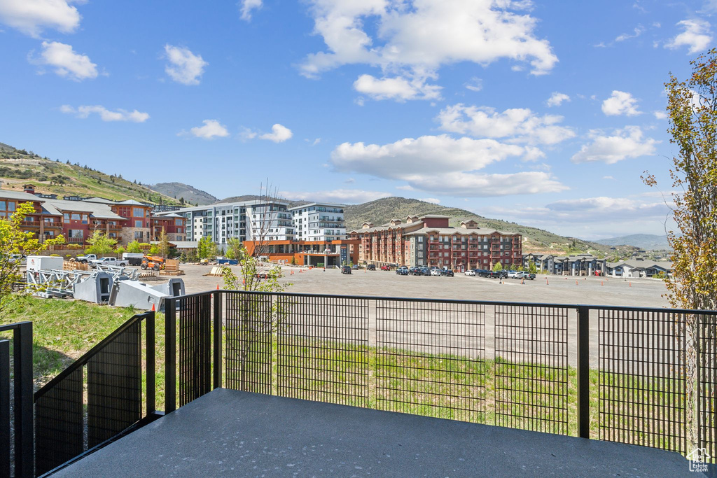 View of patio / terrace featuring a mountain view and a balcony