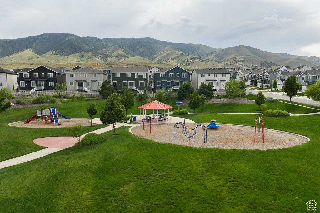 Surrounding community featuring a gazebo, a residential view, a mountain view, and a yard