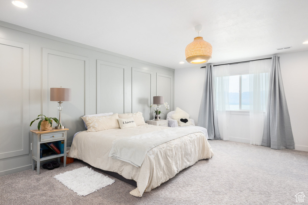 Bedroom featuring recessed lighting, light colored carpet, and baseboards