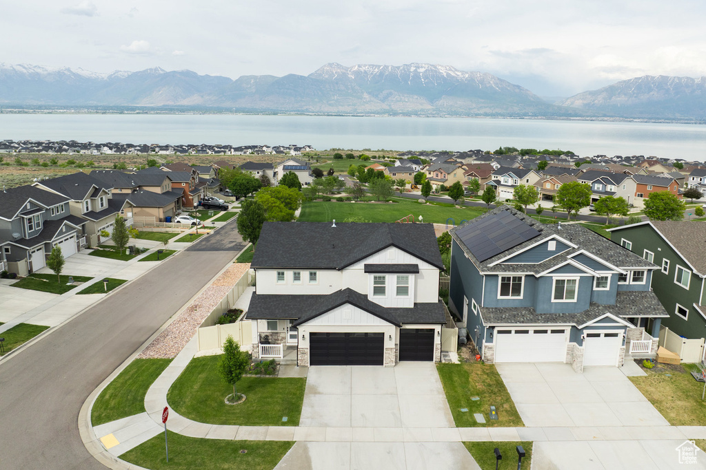 Aerial view of residential area featuring a water and mountain view