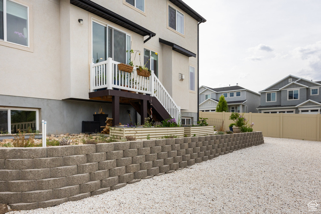Back of property with stucco siding and a residential view