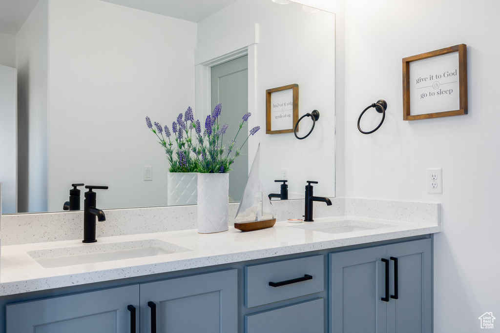 Full bath featuring double vanity