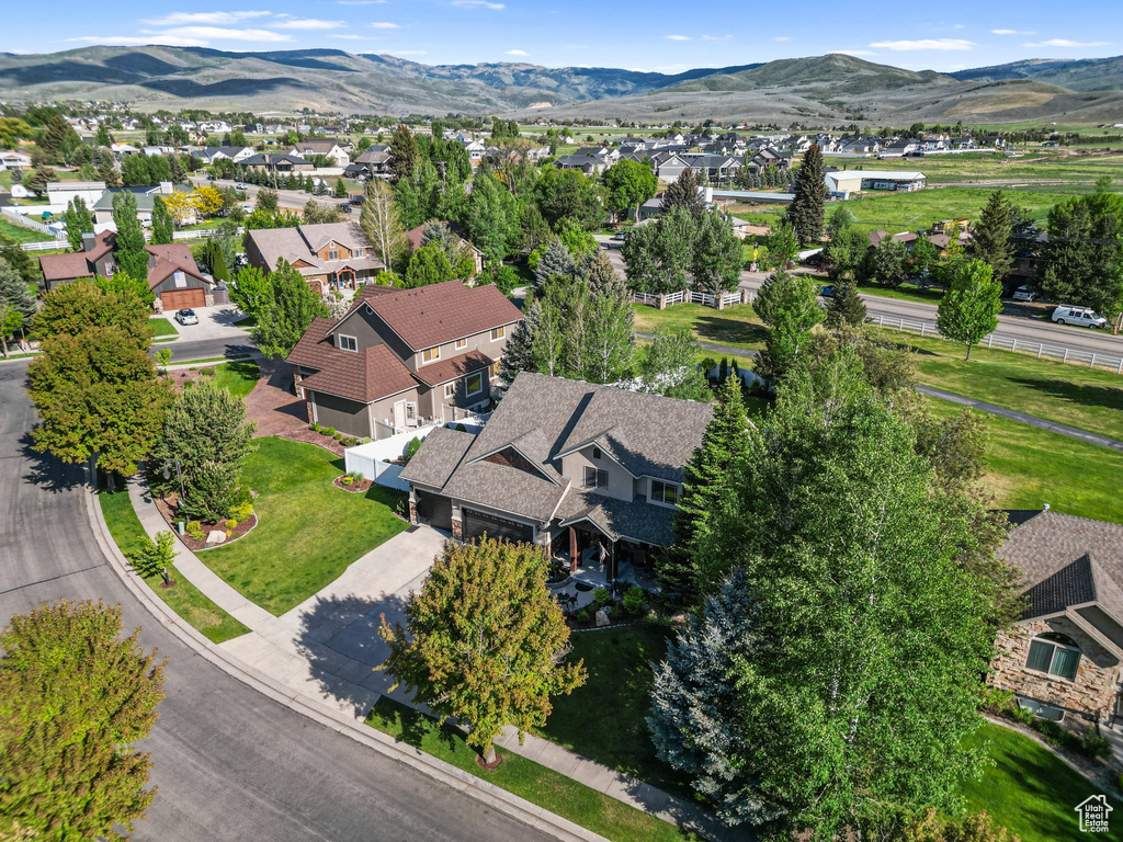 Aerial view of residential area with a mountainous background