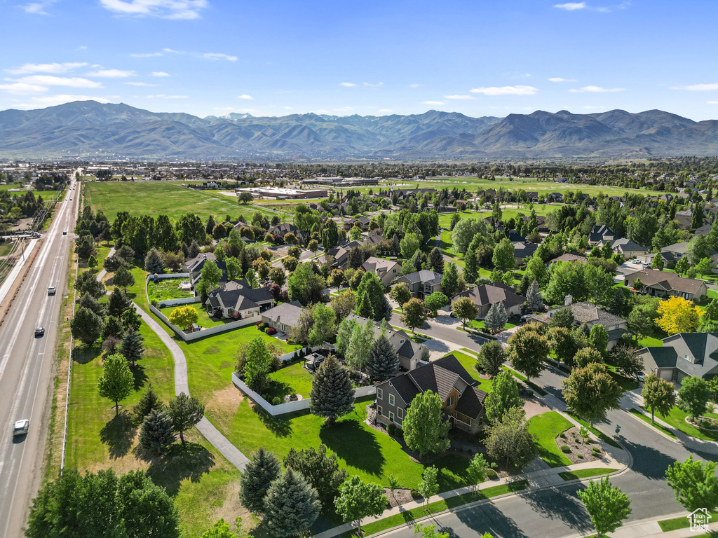 Aerial perspective of suburban area featuring a mountainous background