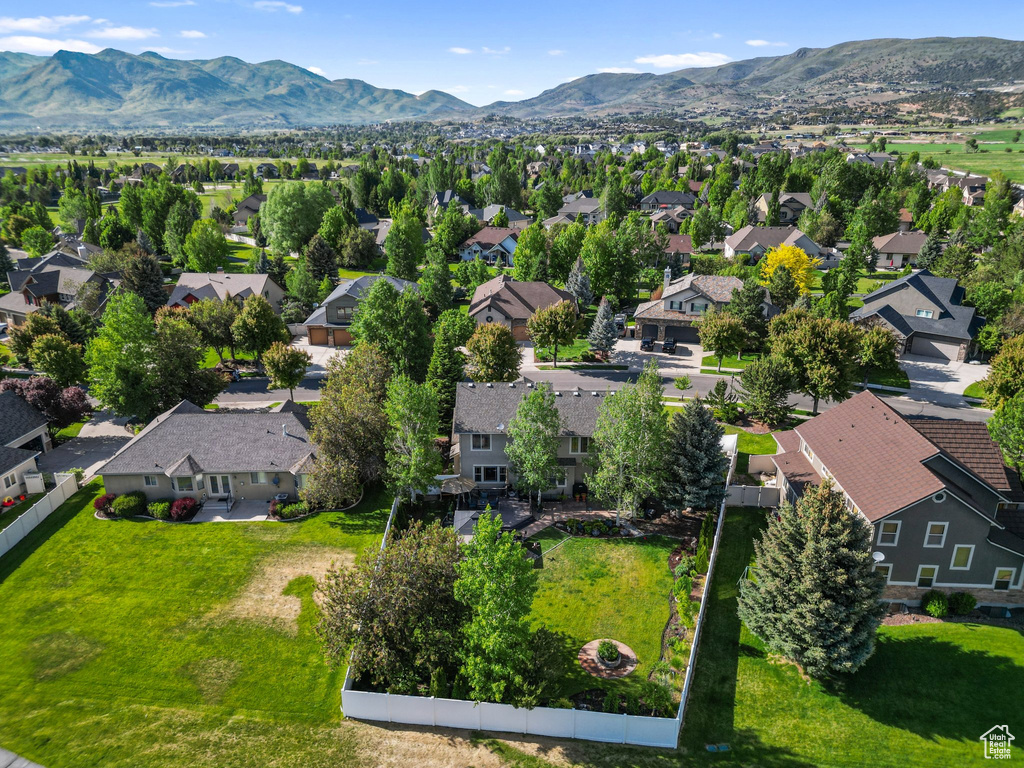 Aerial view of residential area featuring a mountain backdrop