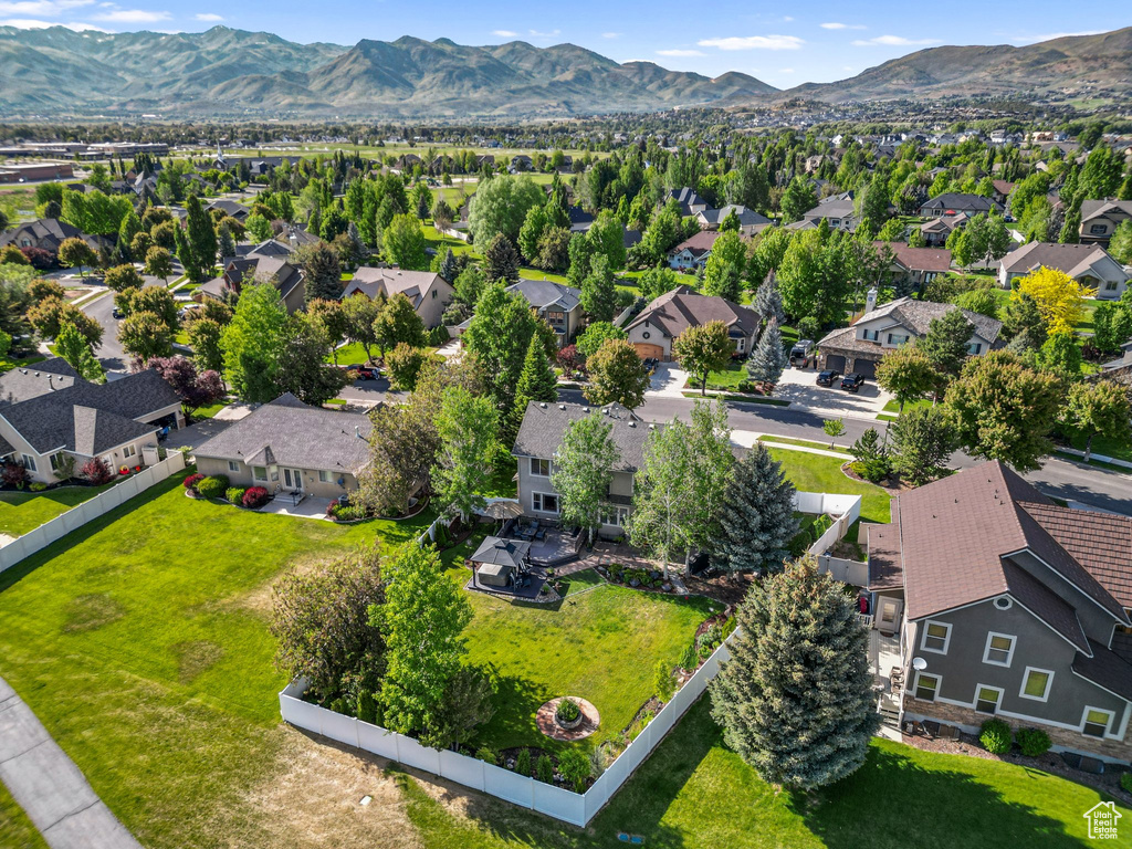 Aerial perspective of suburban area featuring a mountain backdrop