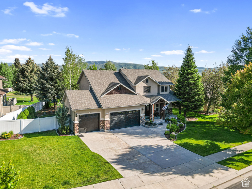 Craftsman house featuring a garage, stone siding, concrete driveway, a porch, and a shingled roof