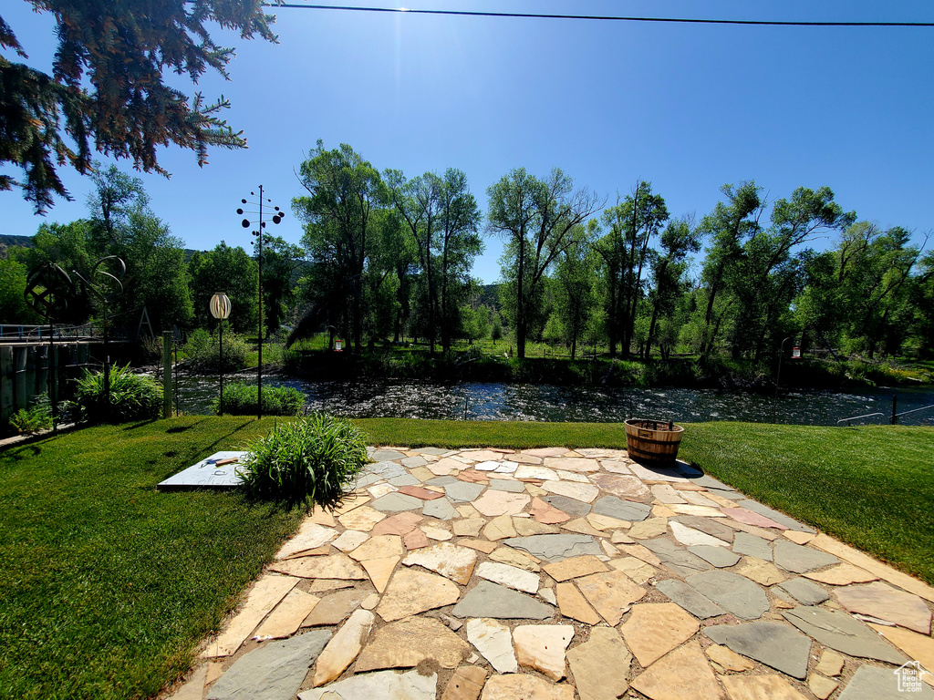 View of patio featuring a fire pit
