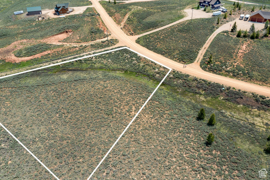 Aerial overview of property's location with property boundaries highlighted and rural landscape