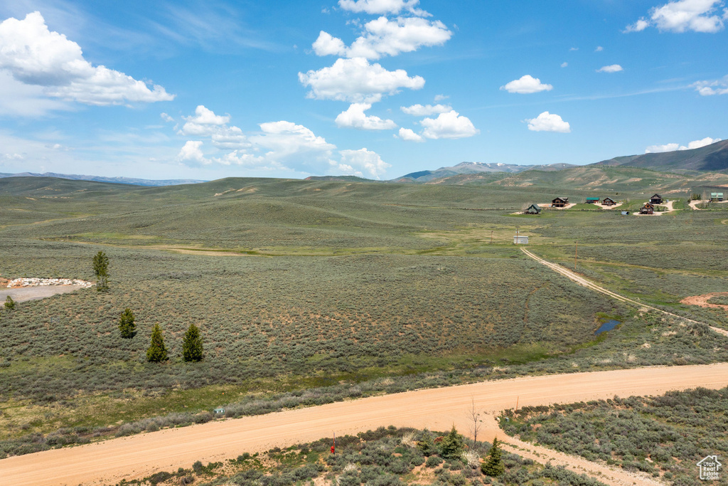 View of mountain backdrop featuring rural landscape