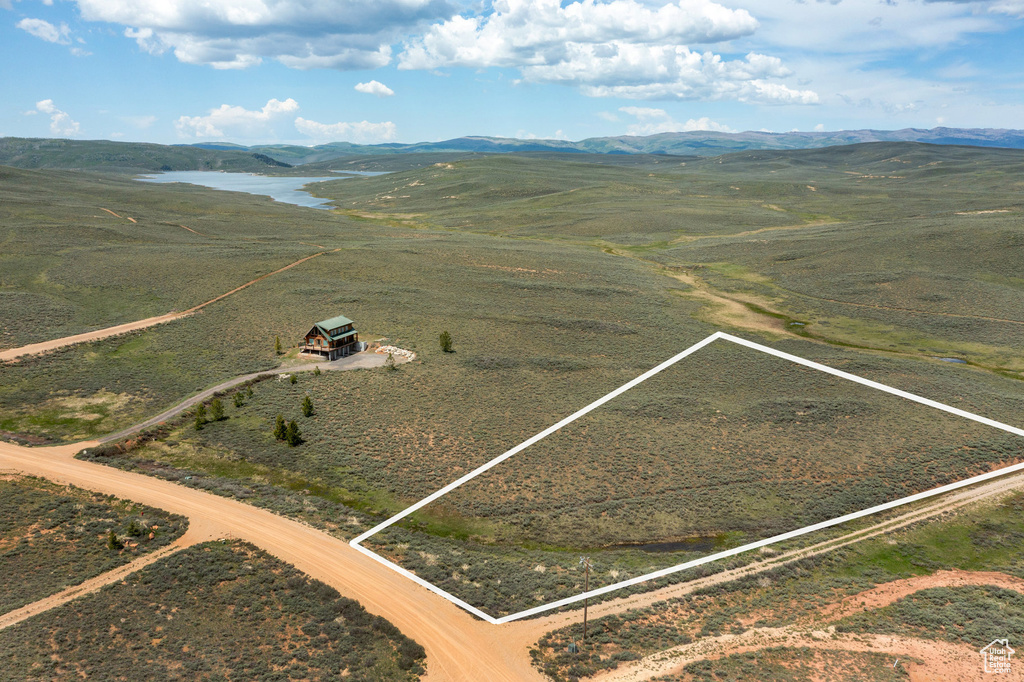 View of rural area featuring property boundaries highlighted and a mountainous background
