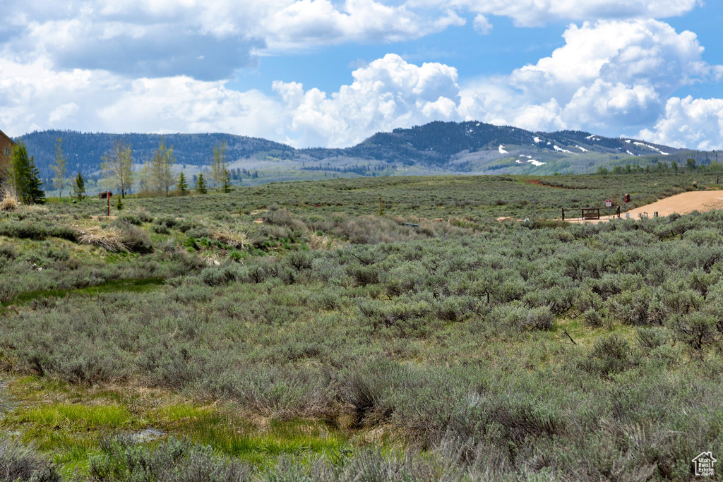 View of mountain backdrop with rural landscape